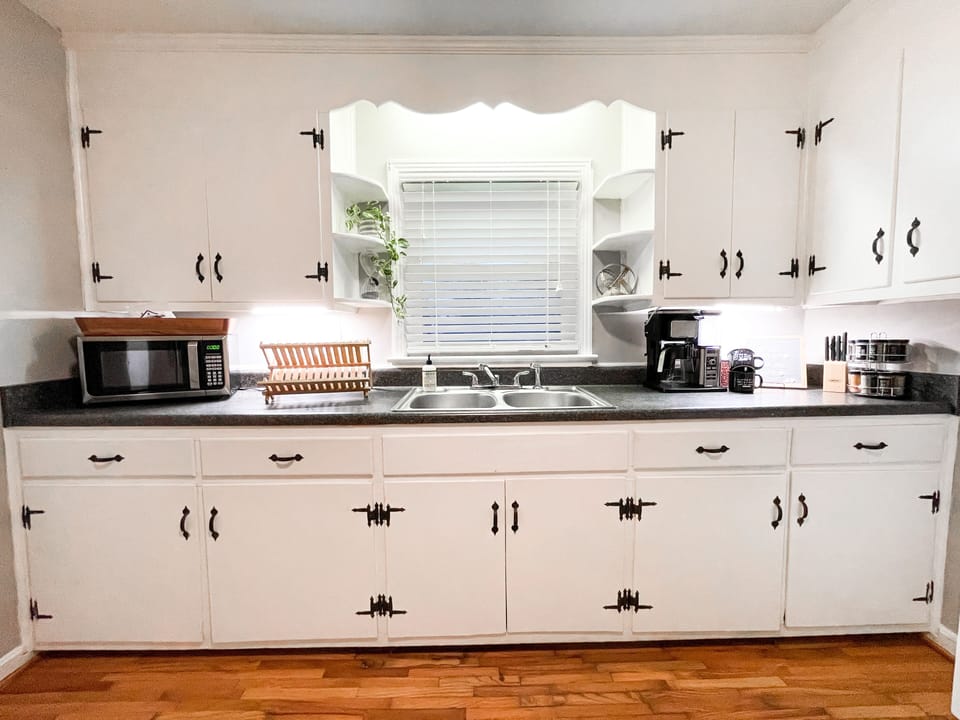 Full kitchen with stove/oven/full size fridge. Drip coffee maker + ground coffee