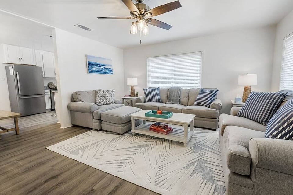 Open floor plan with living area flowing into dining area and kitchen