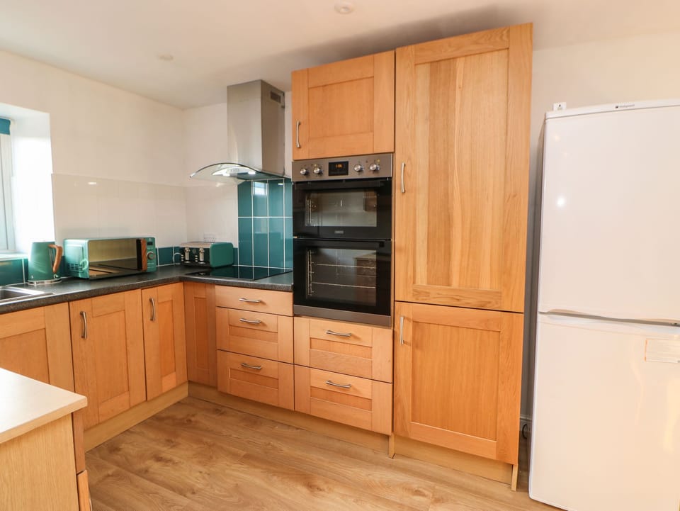 Fridge, electric kettle, toaster, cookware/dishes/utensils