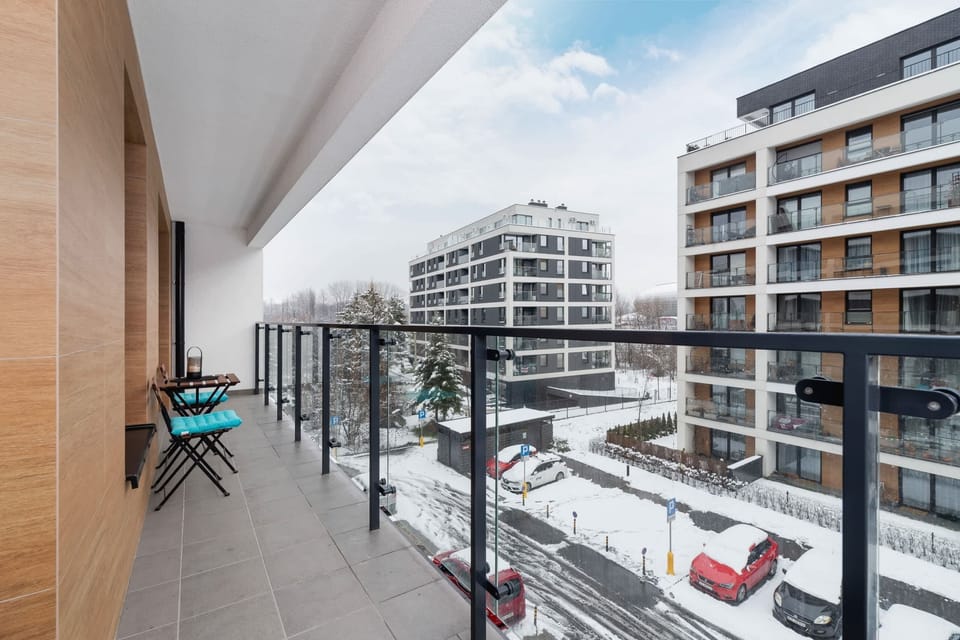 Another view of the balcony, showcasing its spacious layout and modern railing.
