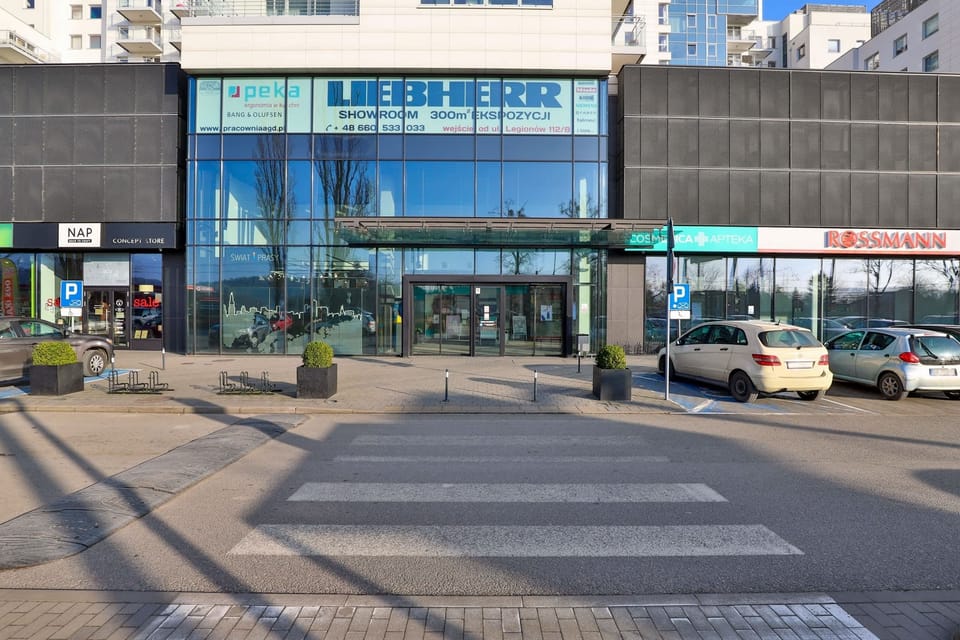 A view of a nearby commercial area with retail shops and easy access to amenities.
