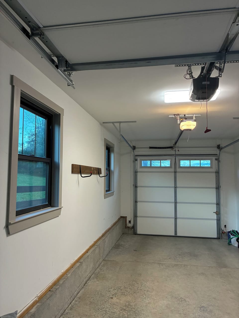 1-car garage and additional parking in driveway behind fence and security gate