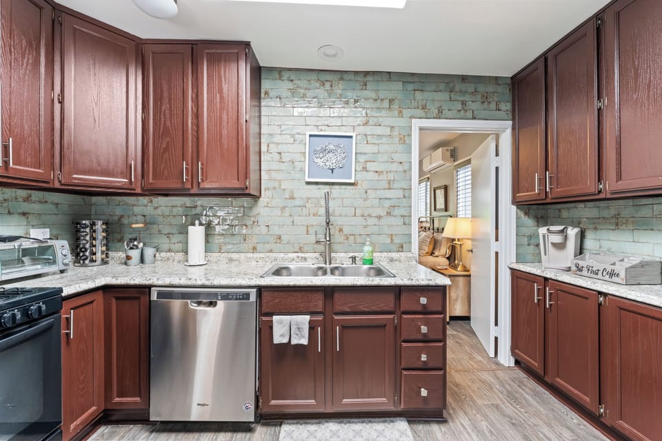 Kitchen Essentials Whip up meals with ease in a fully stocked kitchen—pots, pans, dishes, and a spice rack are all here to inspire your inner chef.