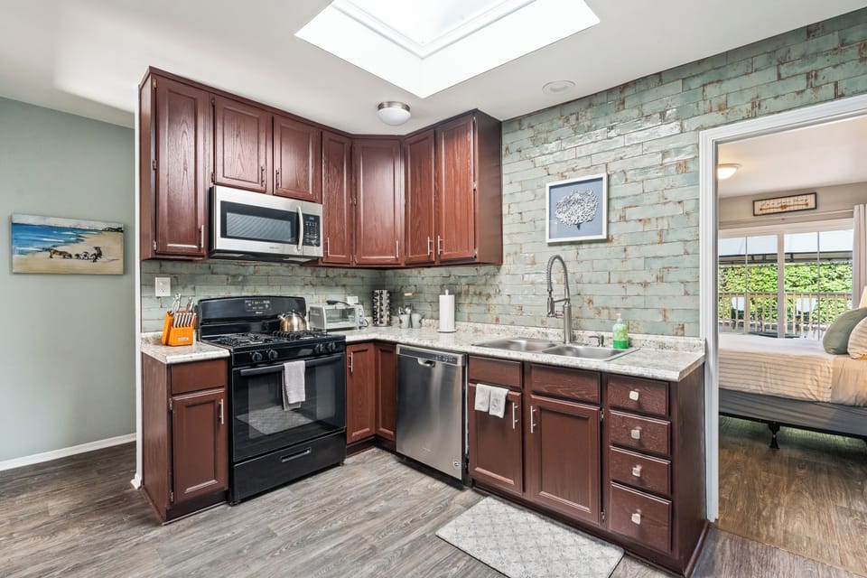 Kitchen Essentials Whip up meals with ease in a fully stocked kitchen—pots, pans, dishes, and a spice rack are all here to inspire your inner chef.
