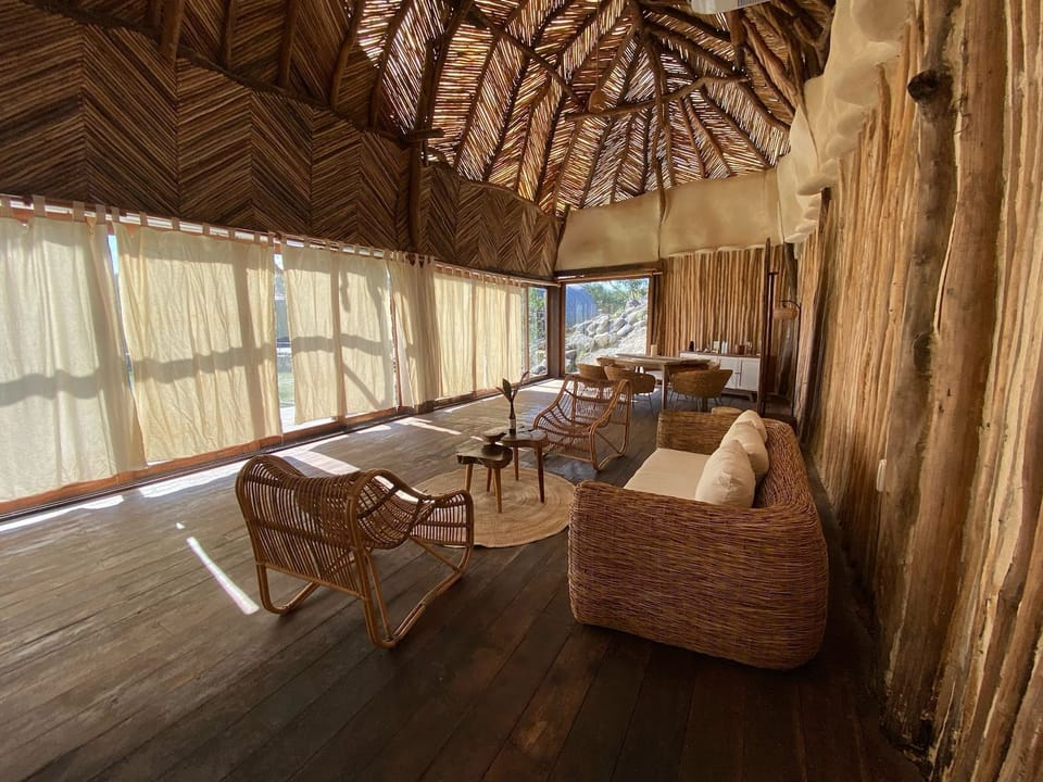 Presidential Overwater Suite | Living room | 60-inch Smart TV with digital channels
