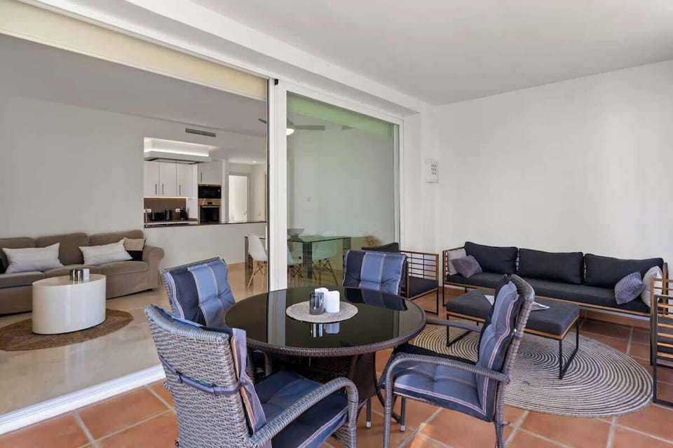 Terrace with folding glass curtain