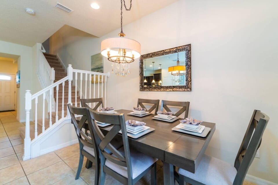Spacious Downstairs Living Area with Comfortable Sofa, Full Size Kitchen, and Dining Area