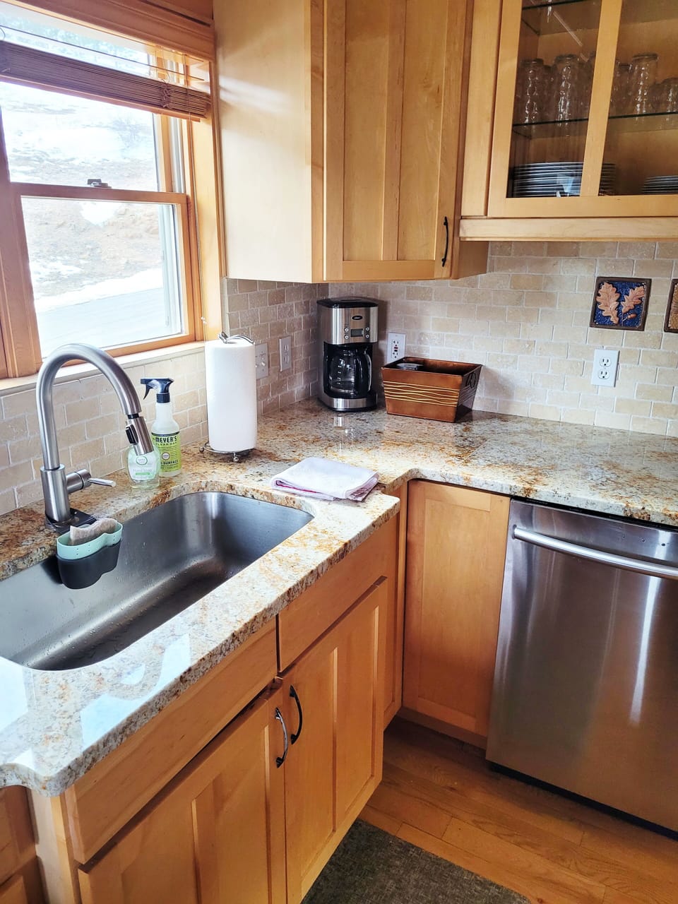 Kitchen includes oven, stove, microwave, dishwasher, coffee maker