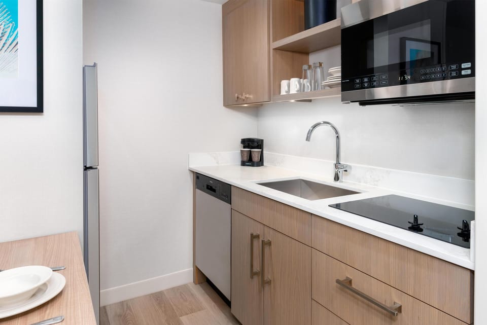 Full-size fridge, microwave, stovetop, dishwasher