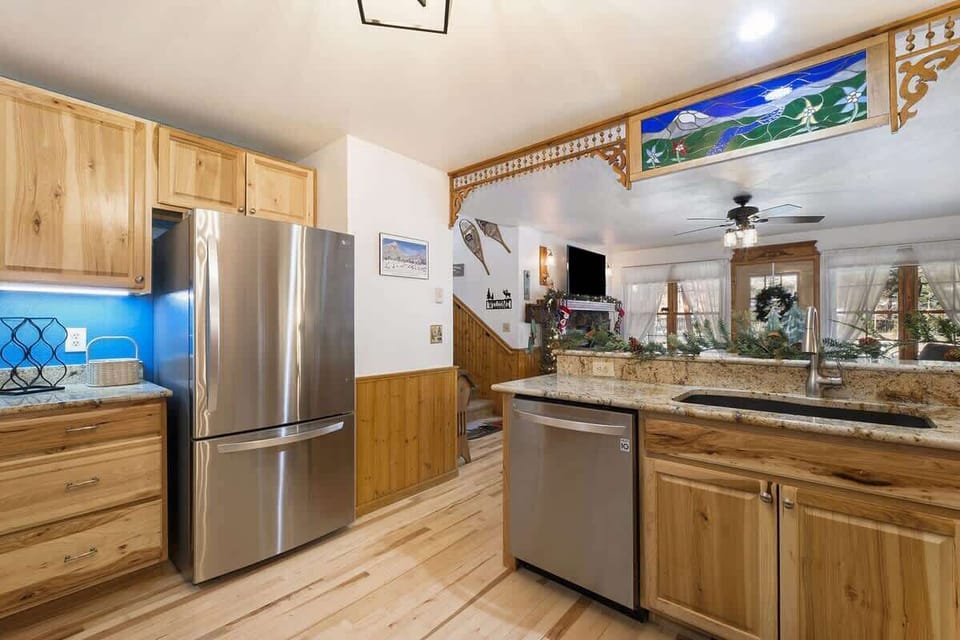 Open concept kitchen with views of dining and living area