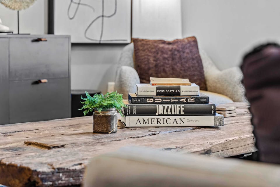 Charming details like curated coffee table books add a warm, local touch to your stay.