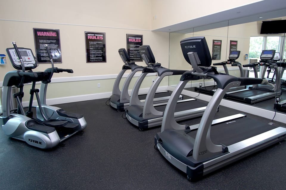 Treadmills and ellipticals face a mirrored wall at Mar Vista Grande 607, Ocean Drive