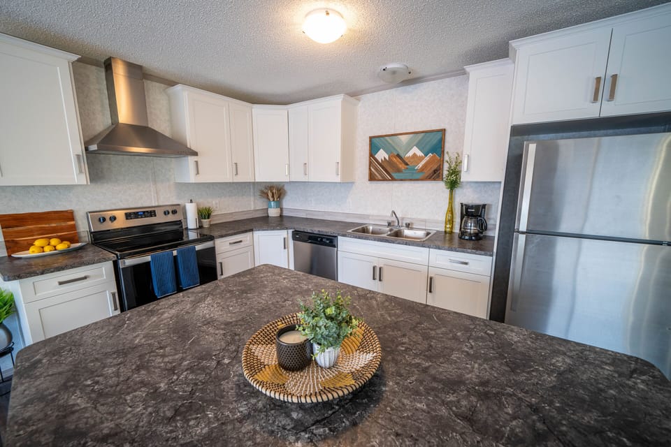Large kitchen island and bar stools for watching the chefs at work.