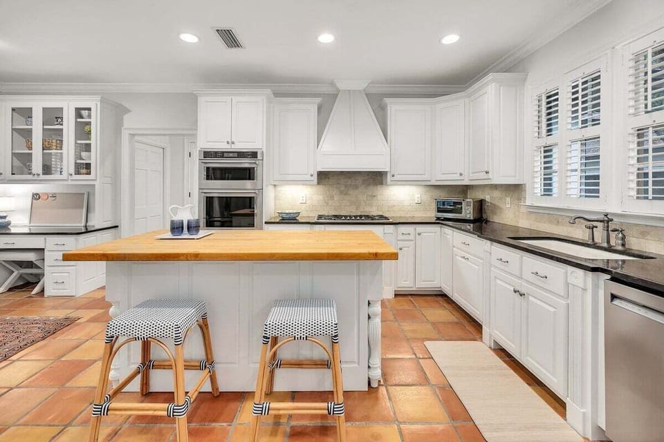 Frontal view of open-concept kitchen with island seating