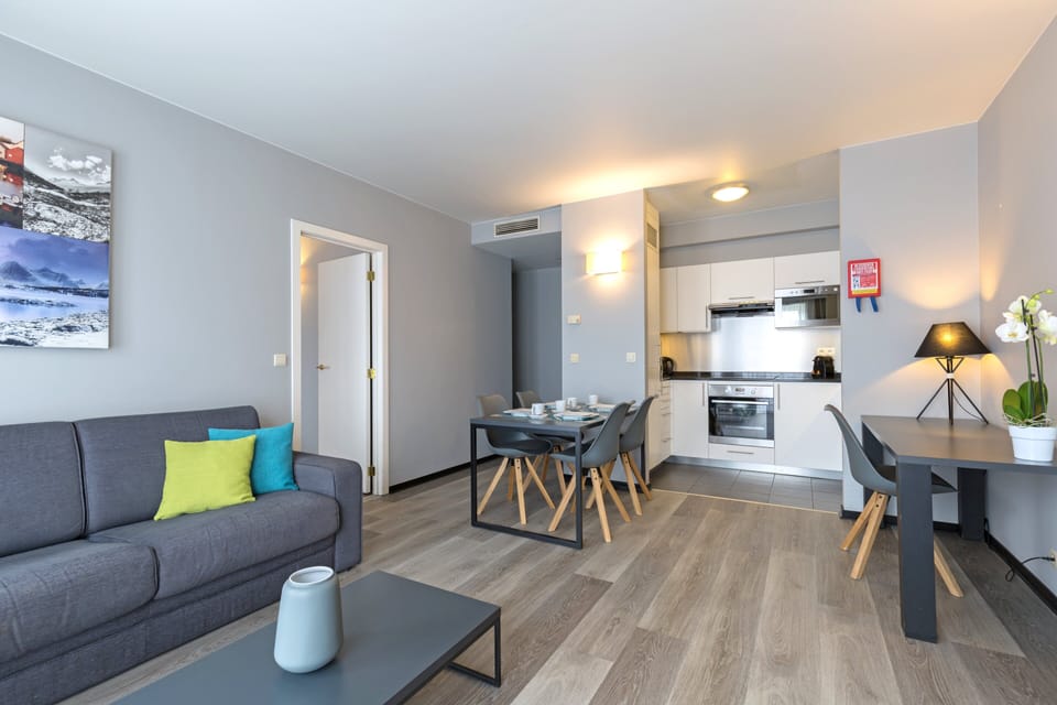 Apartment, 1 Bedroom (Street View) | In-room safe, desk, laptop workspace, iron/ironing board