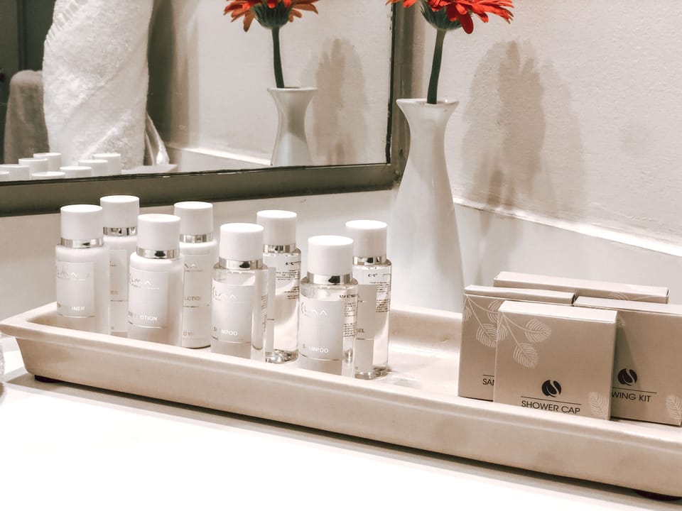 Combined shower/tub, designer toiletries, hair dryer, bathrobes
