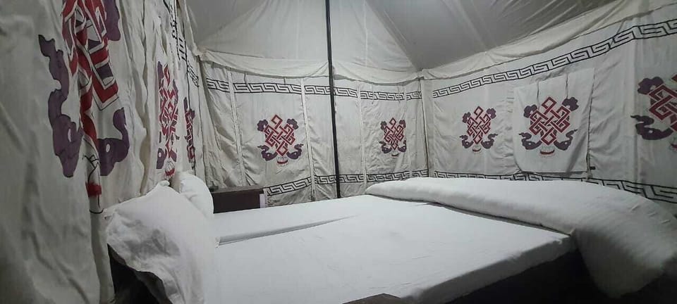 Deluxe Tent | 15 bedrooms, blackout drapes, bed sheets