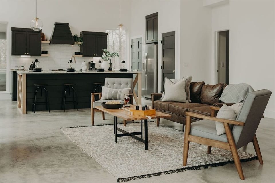 Living Room: Stylish seating and gourmet kitchen create a perfect hangout after outdoor adventures!