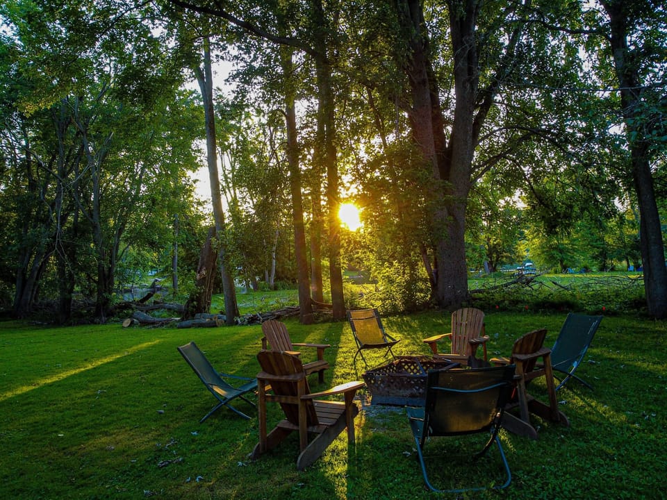 Gather around the fire pit—8 chairs, crackling flames, and firewood included for effortless evenings.
