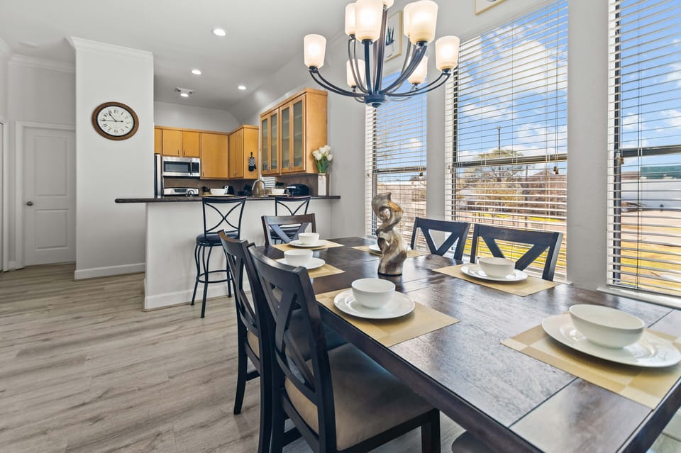Open concept dining room to share a warm meal on this table for 6 people.