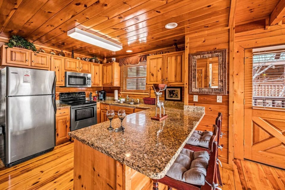 Full-sized kitchen with a suite of stainless steel appliances.