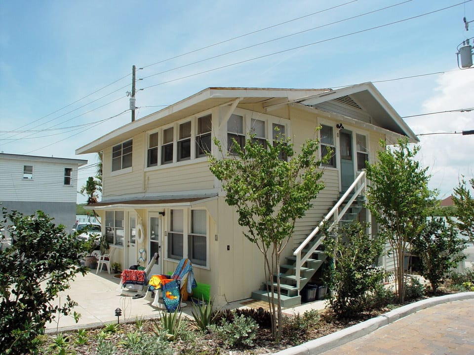 100 year old carriage house before condo was built next door.