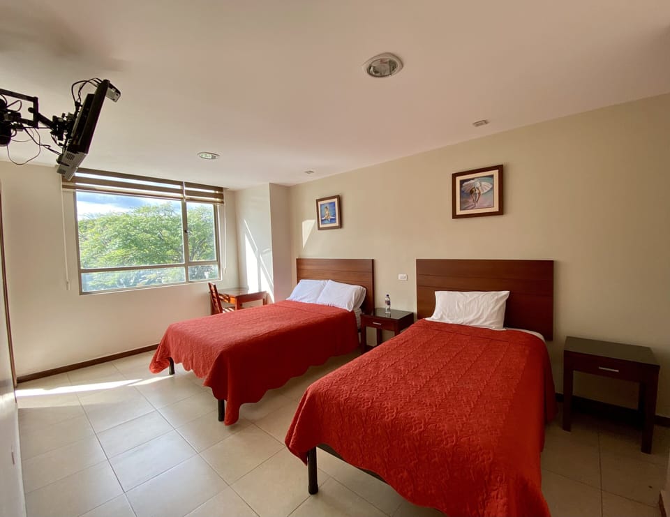 Family Double Room | Down comforters, desk, laptop workspace, blackout drapes