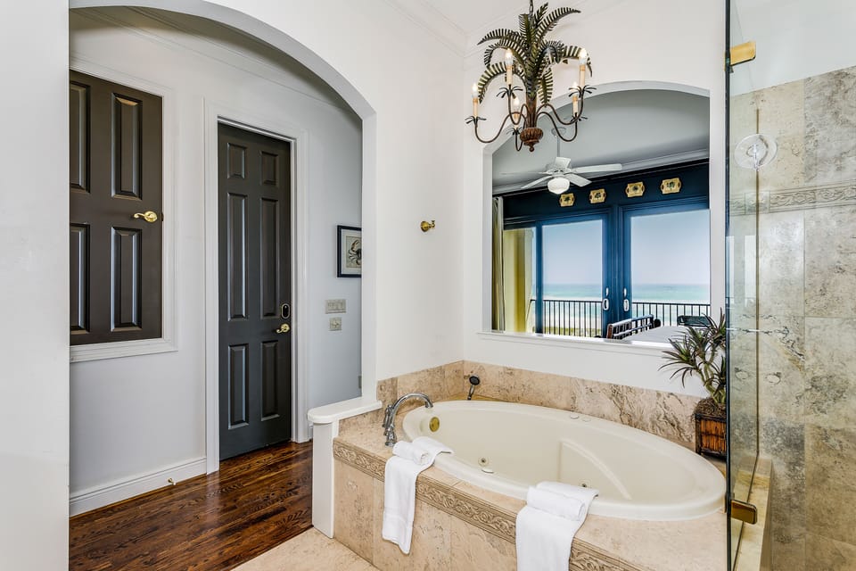 Maranatha House Master Bedroom with a Balcony tub. 