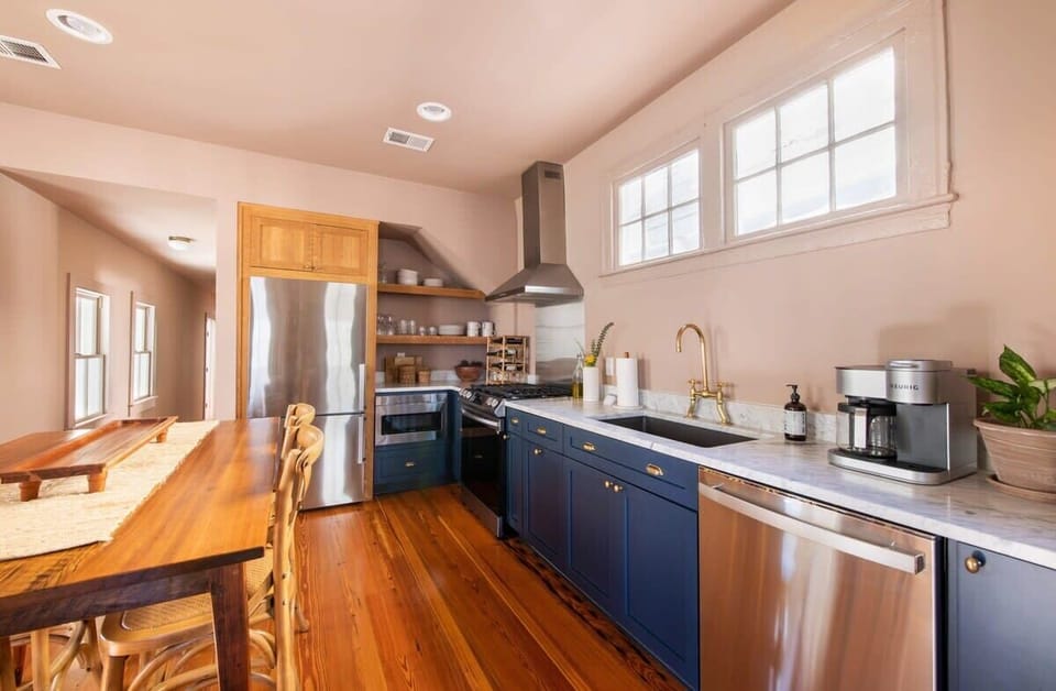 Fully equipped kitchen stocked with diningware, cookware, and modern appliances for easy meals at home.