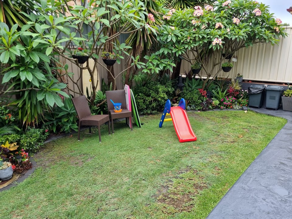 fully gated and fenced yard with grass for pets