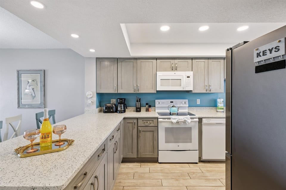 Modern kitchen with sleek countertops and updated appliances