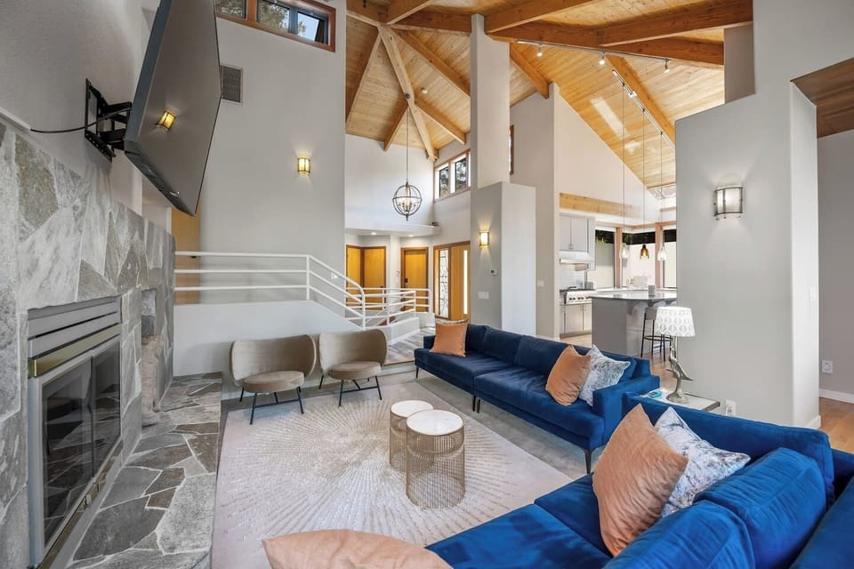 Upstairs living room with couch/chair seating for 9 and two more with floor cushions. 75