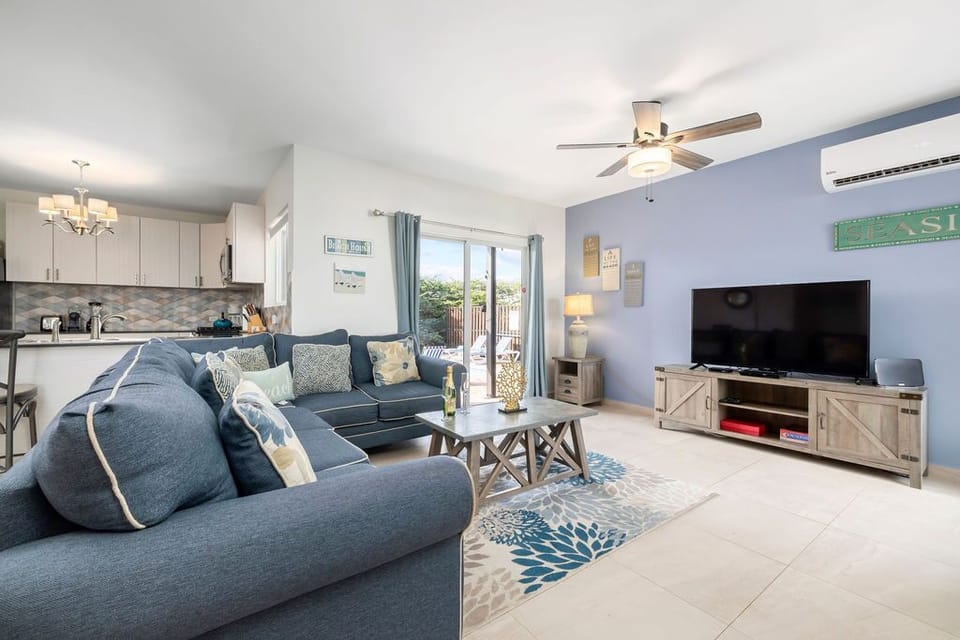 In the living room, you can watch your favorite shows or simply relax on the sofa.