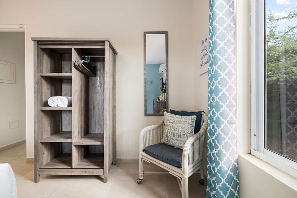 An open closet for your clothes and other belongings.