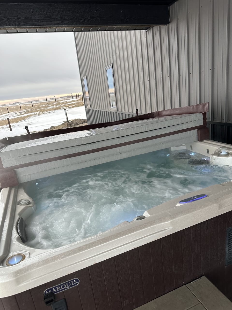 Hot tub located on the east side of the rental.  