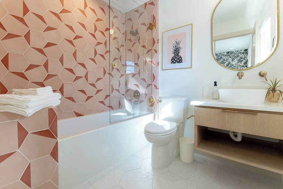 Bathroom 1 is the ensuite bathroom for Bedroom 1 and has a shower/tub combination