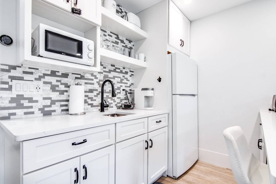 Kitchen includes a refrigerator, microwave, Keurig pod coffee maker, toaster, electric plug-in cooktop & many more!