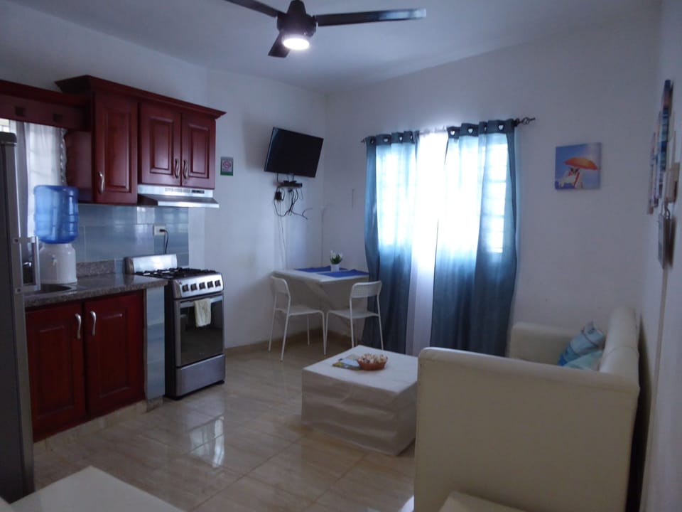 Comfort Apartment | Living area | 32-inch flat-screen TV with cable channels, TV, Netflix