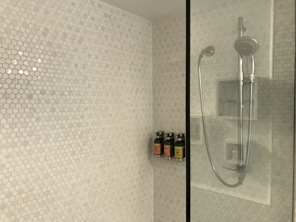 Shower, designer toiletries, hair dryer, bathrobes