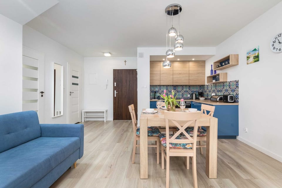 Another view of the living space, highlighting the kitchen and dining area in a cohesive layout.
