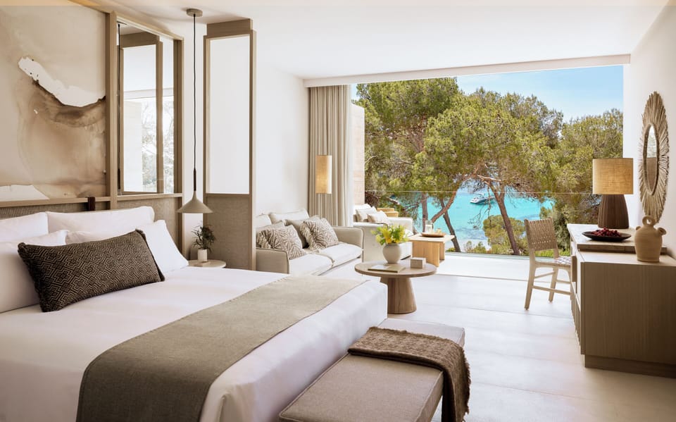 Junior Suite, Sea View (Deluxe) | Minibar, in-room safe, laptop workspace, blackout drapes