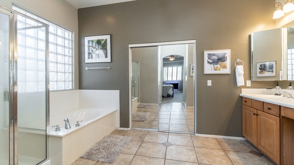 Master bath with walk in closet. - features kids toys and hangers