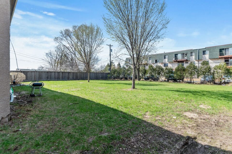 Backyard View 1 - fenced with lots of space to relax, play frisbee with your partner or pet