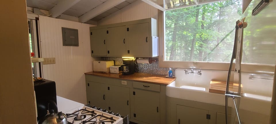 The galley kitchen has rustic 1930s charm.
