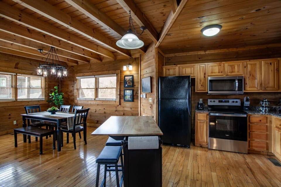 The open kitchen with a central counter creates the perfect flow between cooking and dining.