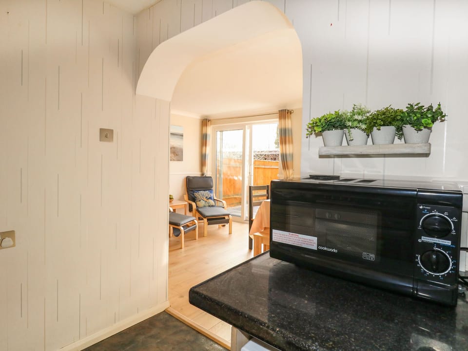 Fridge, electric kettle, toaster, cookware/dishes/utensils