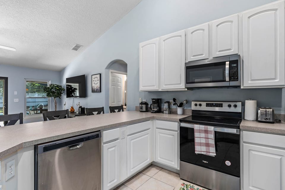 Sleek countertops and white cabinetry for a clean, modern look.