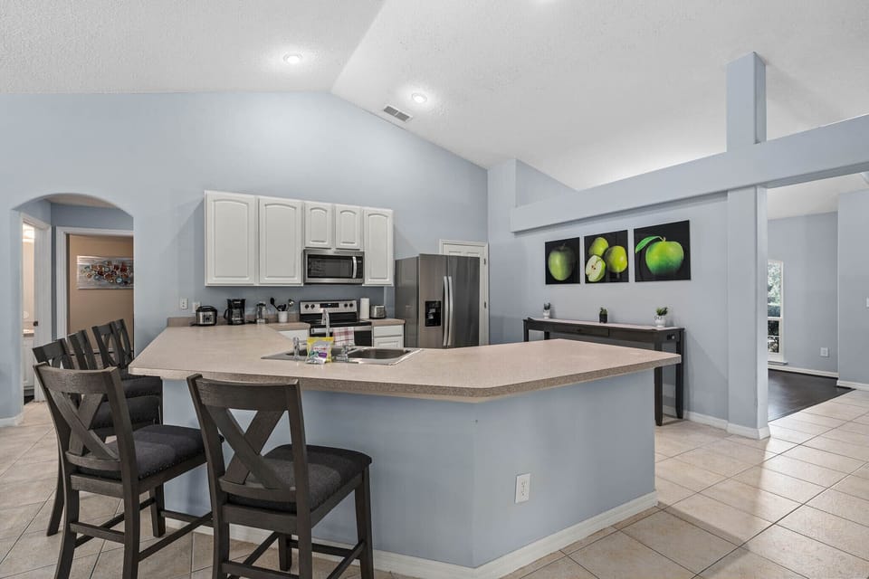 Spacious kitchen island with seating, ideal for casual dining or meal prep.