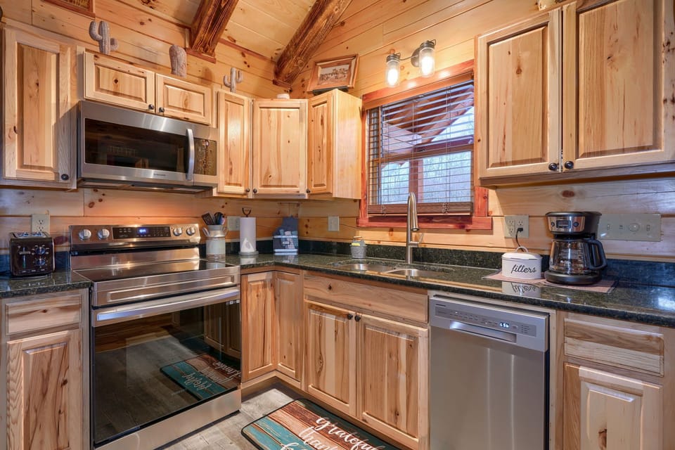 Close-up of Kitchen, with Dishwasher and Granite Countertops - Cowboy Trail cabin