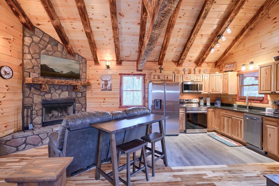 Couple's Table, Seating Area and Fireplace, on left, with Full Kitchen on right - Cowboy Trail cabin